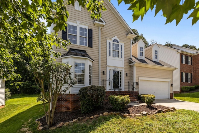 4519 Rock Stream Dr, Charlotte, NC 28269 - traditional home with brick siding, concrete driveway, a front lawn, and a garage