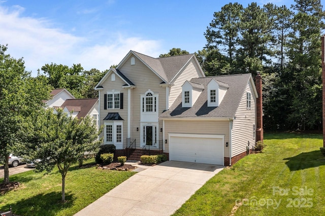 4519 Rock Stream Dr, Charlotte, NC 28269 - traditional-style house with a chimney, driveway, a front yard, and an attached garage