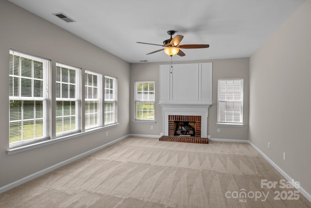 4519 Rock Stream Dr, Charlotte, NC 28269 - unfurnished living room featuring a ceiling fan, light colored carpet, and a fireplace