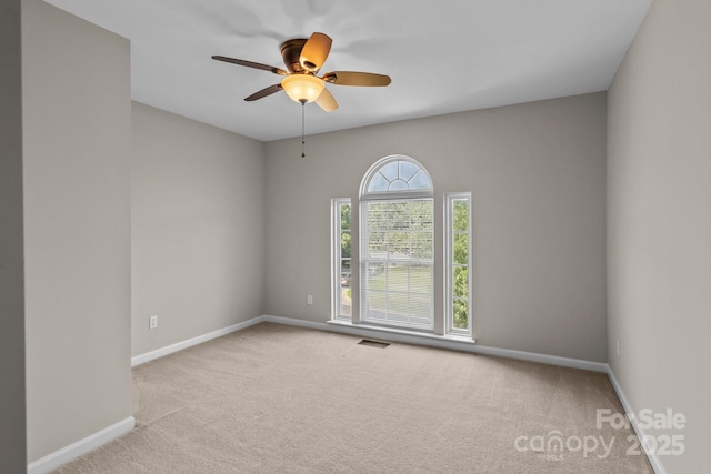4519 Rock Stream Dr, Charlotte, NC 28269 - carpeted empty room with baseboards and a ceiling fan