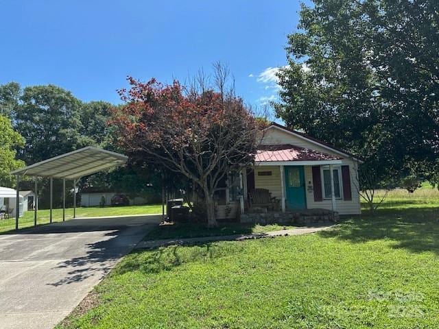 415 Hillside St, Shelby, NC 28152 - view of front of property with covered porch, a front lawn, a carport, and concrete driveway