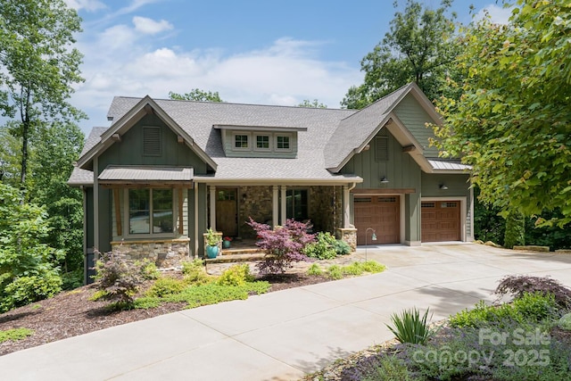 807 Hollybrook Dr, Flat Rock, NC 28731 - craftsman inspired home featuring board and batten siding, concrete driveway, covered porch, stone siding, and a shingled roof