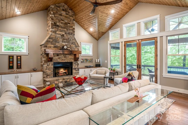 807 Hollybrook Dr, Flat Rock, NC 28731 - living room featuring wood finished floors, high vaulted ceiling, ceiling fan, a stone fireplace, and wood ceiling