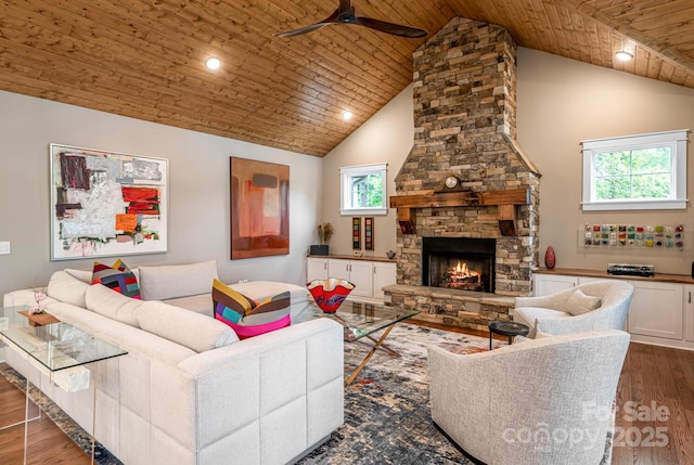 807 Hollybrook Dr, Flat Rock, NC 28731 - living room featuring a ceiling fan, high vaulted ceiling, dark wood finished floors, wood ceiling, and a stone fireplace