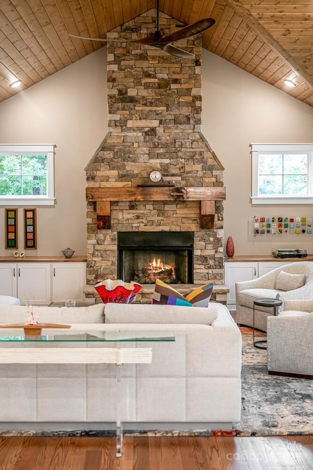 807 Hollybrook Dr, Flat Rock, NC 28731 - living room with wooden ceiling, wood finished floors, high vaulted ceiling, a stone fireplace, and a ceiling fan