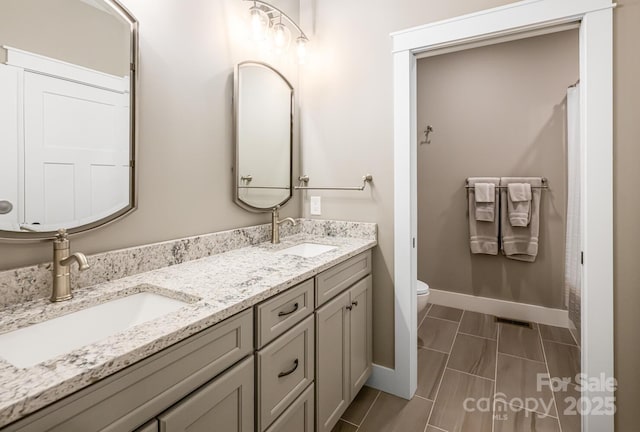 807 Hollybrook Dr, Flat Rock, NC 28731 - full bathroom featuring baseboards and double vanity