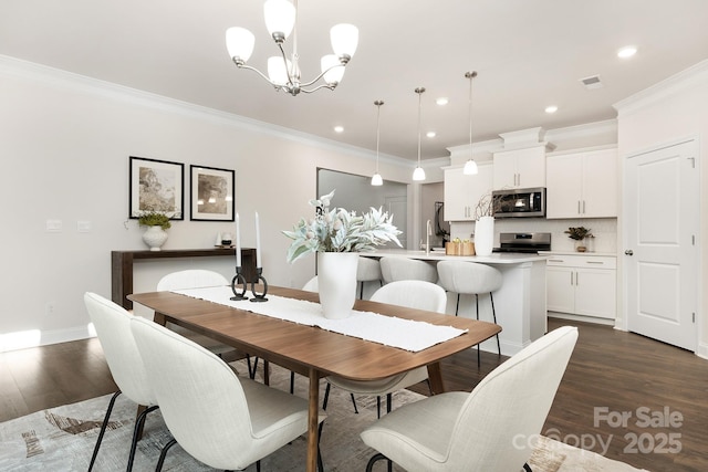 130 S Shayna Rd, Troutman, NC 28166 - dining room with a chandelier, dark wood-type flooring, ornamental molding, and recessed lighting