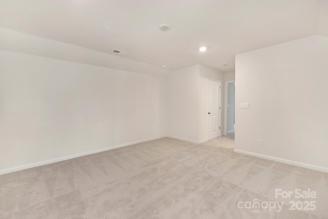 130 S Shayna Rd, Troutman, NC 28166 - spare room with light colored carpet, recessed lighting, and lofted ceiling