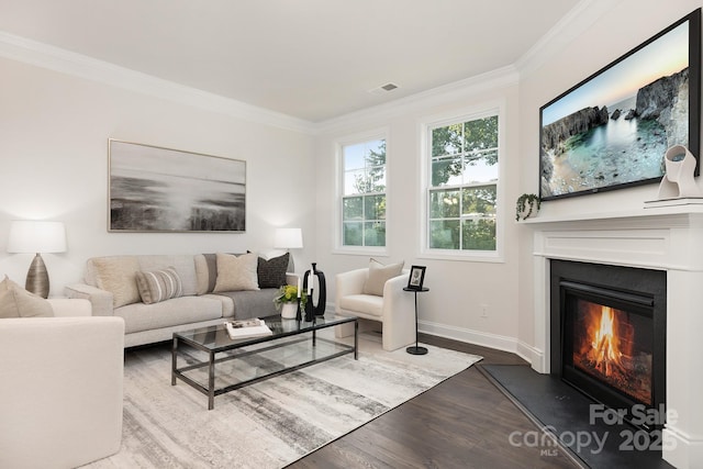 123 S Shayna Rd, Troutman, NC 28166 - living room featuring ornamental molding, dark wood finished floors, and a glass covered fireplace