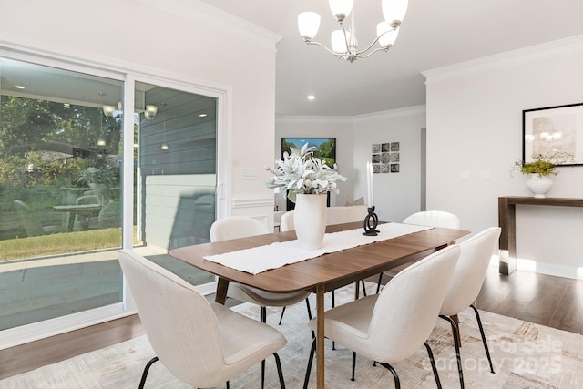 123 S Shayna Rd, Troutman, NC 28166 - dining space with wood finished floors, a chandelier, crown molding, plenty of natural light, and recessed lighting