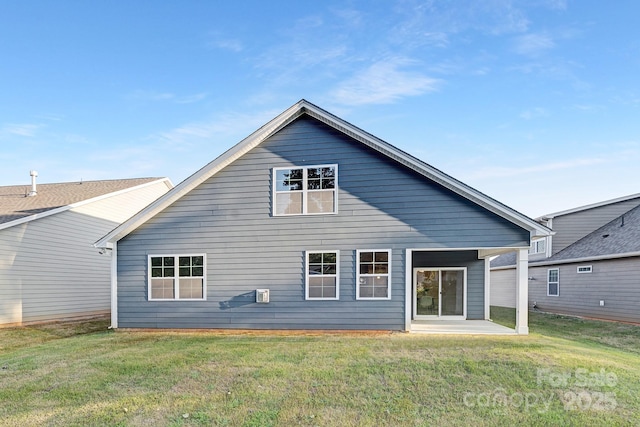 123 S Shayna Rd, Troutman, NC 28166 - back of house featuring a lawn and a patio area