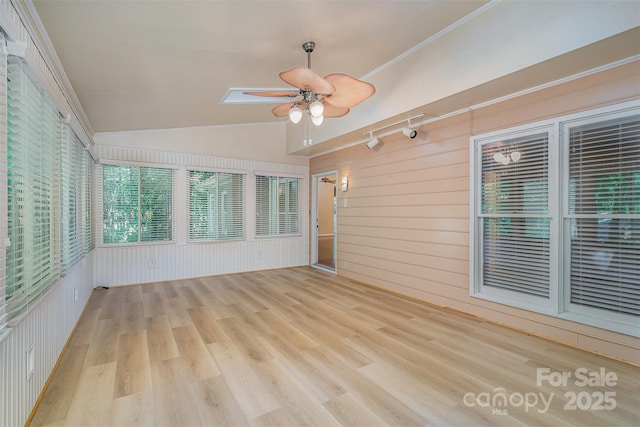 140 Rustic Way Ln, Mooresville, NC 28117 - unfurnished sunroom featuring ceiling fan, wood finished floors, vaulted ceiling, wood walls, and a skylight