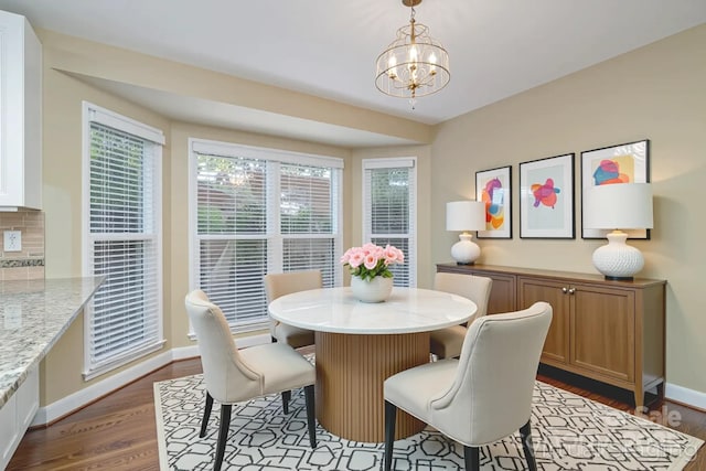 140 Rustic Way Ln, Mooresville, NC 28117 - dining area featuring a chandelier and dark wood finished floors