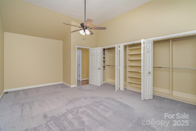 140 Rustic Way Ln, Mooresville, NC 28117 - unfurnished bedroom with carpet floors, two closets, high vaulted ceiling, and a ceiling fan