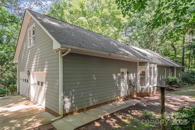 140 Rustic Way Ln, Mooresville, NC 28117 - view of side of property with a shingled roof, concrete driveway, and a garage