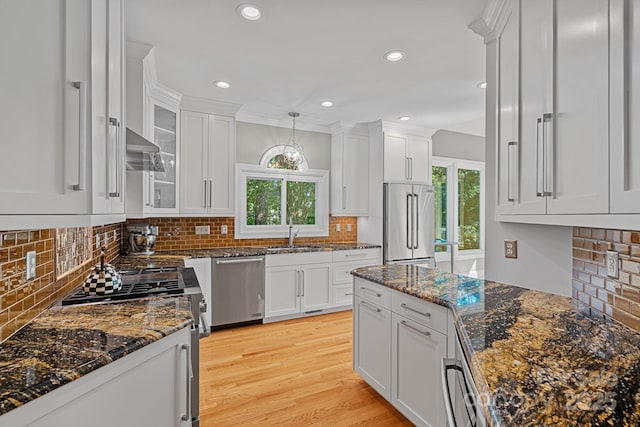 15724 Eagleview Dr, Charlotte, NC 28278 - kitchen with stainless steel appliances, white cabinets, plenty of natural light, and recessed lighting