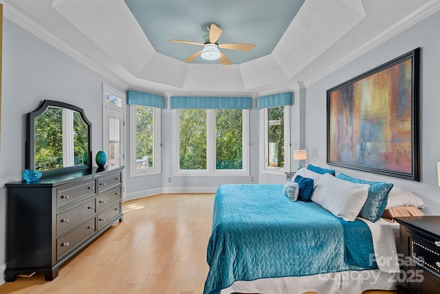 15724 Eagleview Dr, Charlotte, NC 28278 - bedroom with a raised ceiling, light wood finished floors, crown molding, and ceiling fan