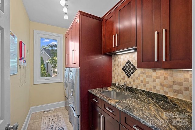 15724 Eagleview Dr, Charlotte, NC 28278 - laundry area featuring cabinet space, washing machine and dryer, and track lighting