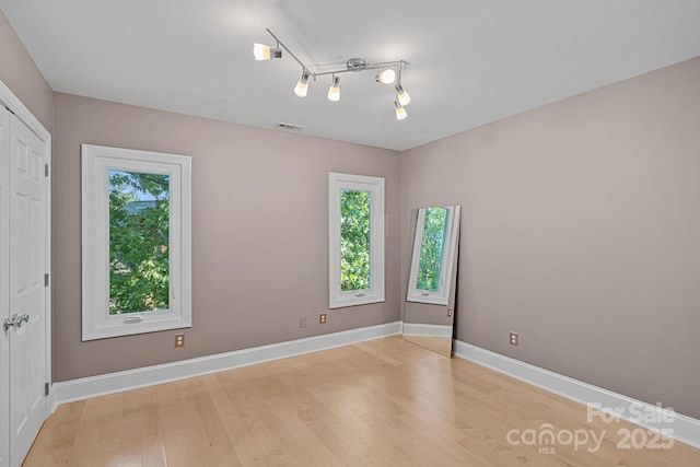 15724 Eagleview Dr, Charlotte, NC 28278 - spare room with plenty of natural light and light wood-type flooring