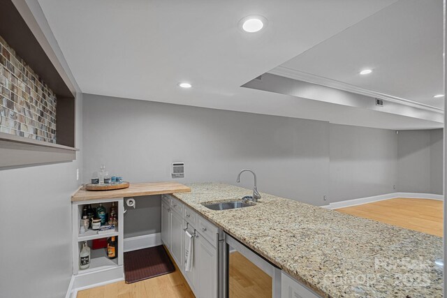 15724 Eagleview Dr, Charlotte, NC 28278 - kitchen featuring beverage cooler, light wood finished floors, light stone counters, open shelves, and recessed lighting