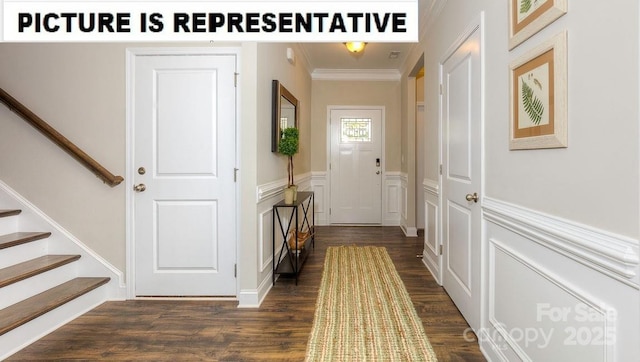 502 York Rd, Troutman, NC 28166 - corridor with dark wood finished floors, ornamental molding, stairway, a wainscoted wall, and a decorative wall