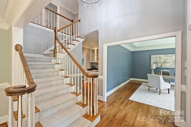 2317 Houston Branch Rd, Charlotte, NC 28270 - stairs with wood finished floors, ornamental molding, and a high ceiling