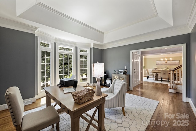 2317 Houston Branch Rd, Charlotte, NC 28270 - home office with a raised ceiling, a chandelier, wood finished floors, and ornamental molding