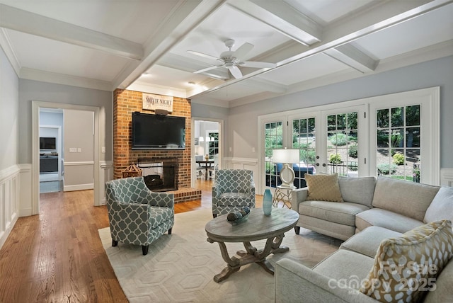 2317 Houston Branch Rd, Charlotte, NC 28270 - living area featuring coffered ceiling, beam ceiling, light wood-style flooring, a fireplace, and ceiling fan