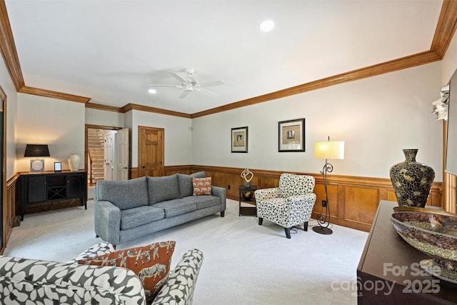 2317 Houston Branch Rd, Charlotte, NC 28270 - living room featuring light colored carpet, a wainscoted wall, ornamental molding, a ceiling fan, and recessed lighting