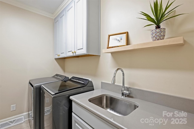 2317 Houston Branch Rd, Charlotte, NC 28270 - washroom with washing machine and dryer, ornamental molding, and cabinet space
