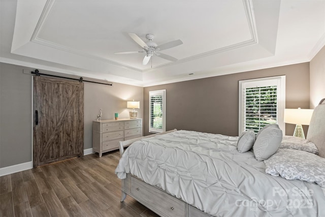 2317 Houston Branch Rd, Charlotte, NC 28270 - bedroom with a tray ceiling, multiple windows, a barn door, and crown molding