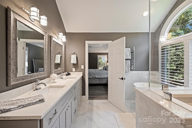 2317 Houston Branch Rd, Charlotte, NC 28270 - ensuite bathroom with double vanity, marble finish floors, lofted ceiling, and a tub to relax in
