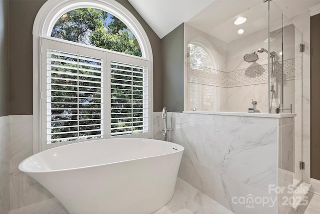 2317 Houston Branch Rd, Charlotte, NC 28270 - bathroom featuring a marble finish shower, a freestanding bath, marble tiled floors, tile walls, and lofted ceiling