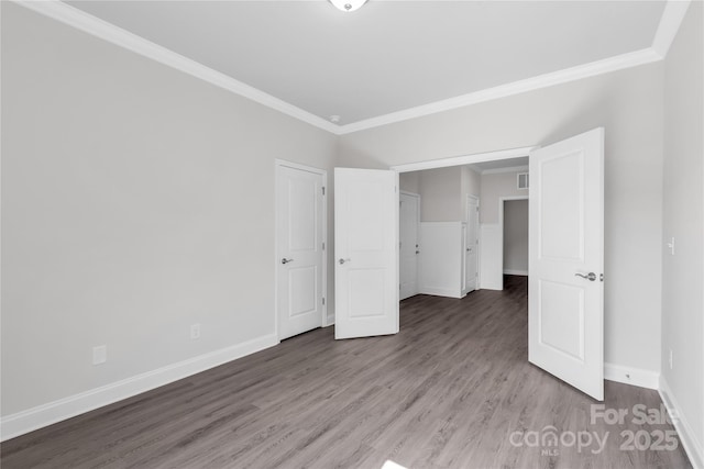 10180 Lakeshore Dr, Lancaster, SC 29720 - unfurnished bedroom with ornamental molding and wood finished floors