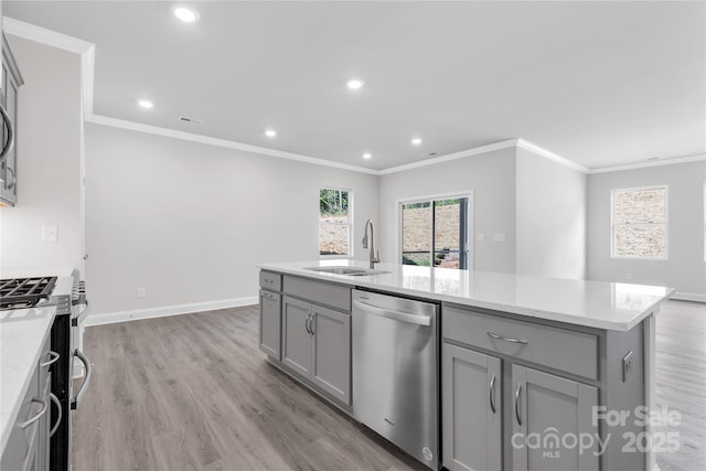 10180 Lakeshore Dr, Lancaster, SC 29720 - kitchen with stainless steel appliances, gray cabinetry, crown molding, a center island with sink, and light wood finished floors