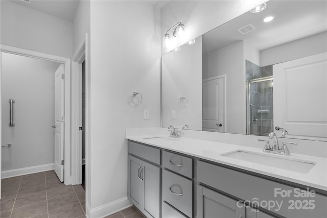 10180 Lakeshore Dr, Lancaster, SC 29720 - bathroom featuring double vanity, a stall shower, and tile patterned floors