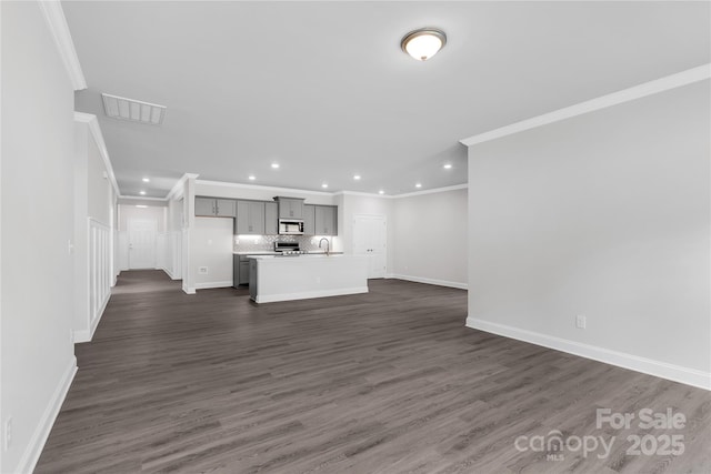 10180 Lakeshore Dr, Lancaster, SC 29720 - unfurnished living room with crown molding, recessed lighting, and dark wood-type flooring