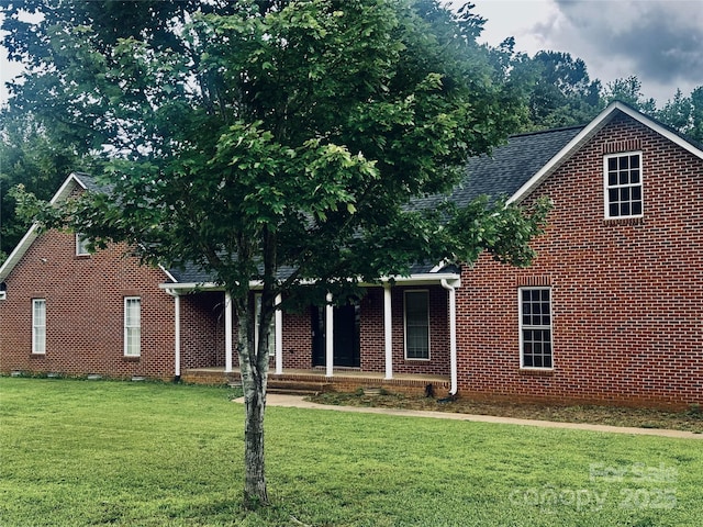 2765 Dogwood Cir, Rock Hill, SC 29732 - view of front of property featuring covered porch, a front lawn, brick siding, and roof with shingles