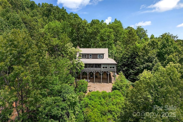 35 Elderberry Dr Unit 805, Old Fort, NC 28762 - back of house with a wooded view, a deck, a carport, and a metal roof