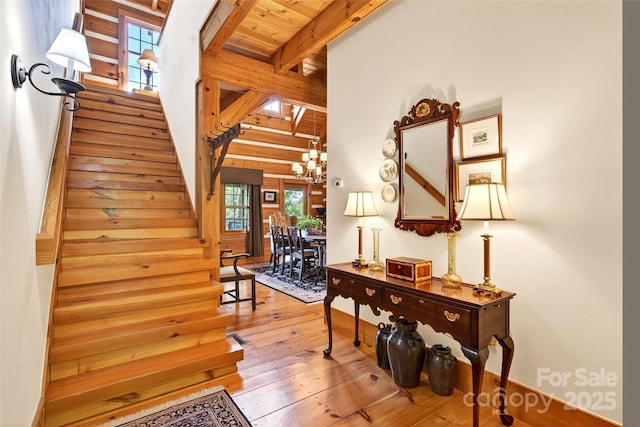 35 Elderberry Dr Unit 805, Old Fort, NC 28762 - staircase featuring hardwood / wood-style floors, beamed ceiling, and a chandelier