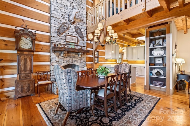 35 Elderberry Dr Unit 805, Old Fort, NC 28762 - dining room featuring light wood finished floors, a fireplace, and a wood ceiling with exposed beams