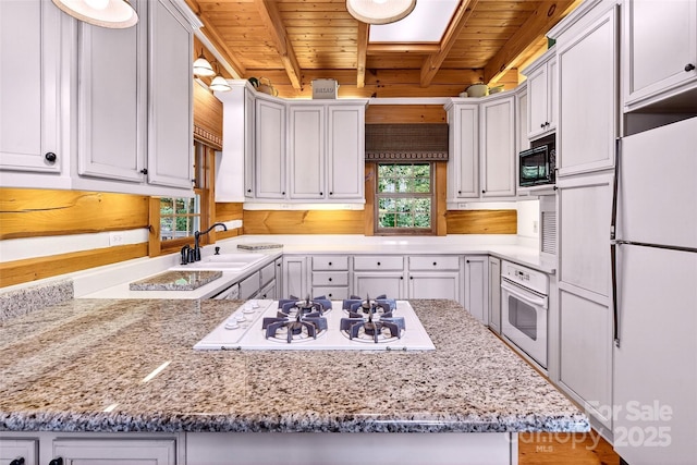 35 Elderberry Dr Unit 805, Old Fort, NC 28762 - kitchen featuring white appliances, a wooden ceiling with exposed beams, light stone countertops, a peninsula, and white cabinets
