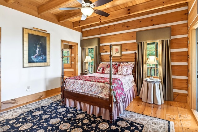 35 Elderberry Dr Unit 805, Old Fort, NC 28762 - bedroom featuring a wood ceiling with exposed beams, wood walls, wood-type flooring, and ensuite bathroom