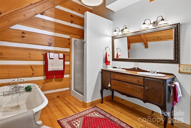 35 Elderberry Dr Unit 805, Old Fort, NC 28762 - bathroom featuring hardwood / wood-style flooring, double vanity, a soaking tub, and a stall shower