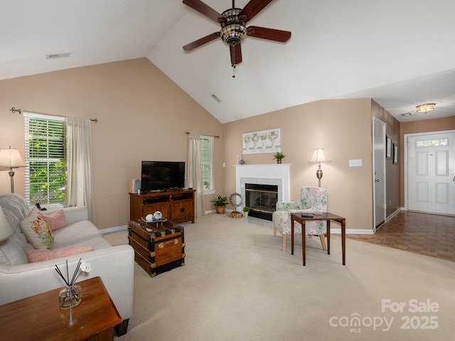 11911 Brownestone View Dr, Charlotte, NC 28269 - carpeted living room featuring ceiling fan, a premium fireplace, and high vaulted ceiling