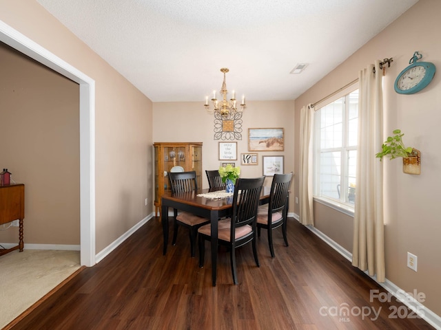 11911 Brownestone View Dr, Charlotte, NC 28269 - dining space featuring a chandelier and dark wood finished floors