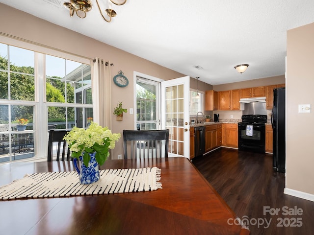 11911 Brownestone View Dr, Charlotte, NC 28269 - dining space featuring dark wood-style flooring and baseboards