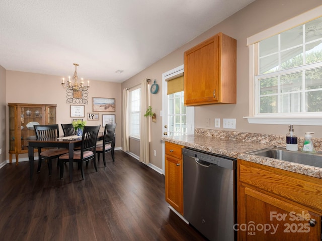 11911 Brownestone View Dr, Charlotte, NC 28269 - kitchen featuring stainless steel dishwasher, dark wood-style flooring, a chandelier, and plenty of natural light