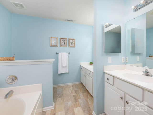 11911 Brownestone View Dr, Charlotte, NC 28269 - full bathroom with two vanities and a bath