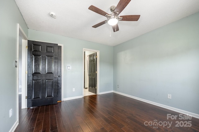 2070 Rocketts Way, Newton, NC 28658 - unfurnished bedroom with wood finished floors and ceiling fan